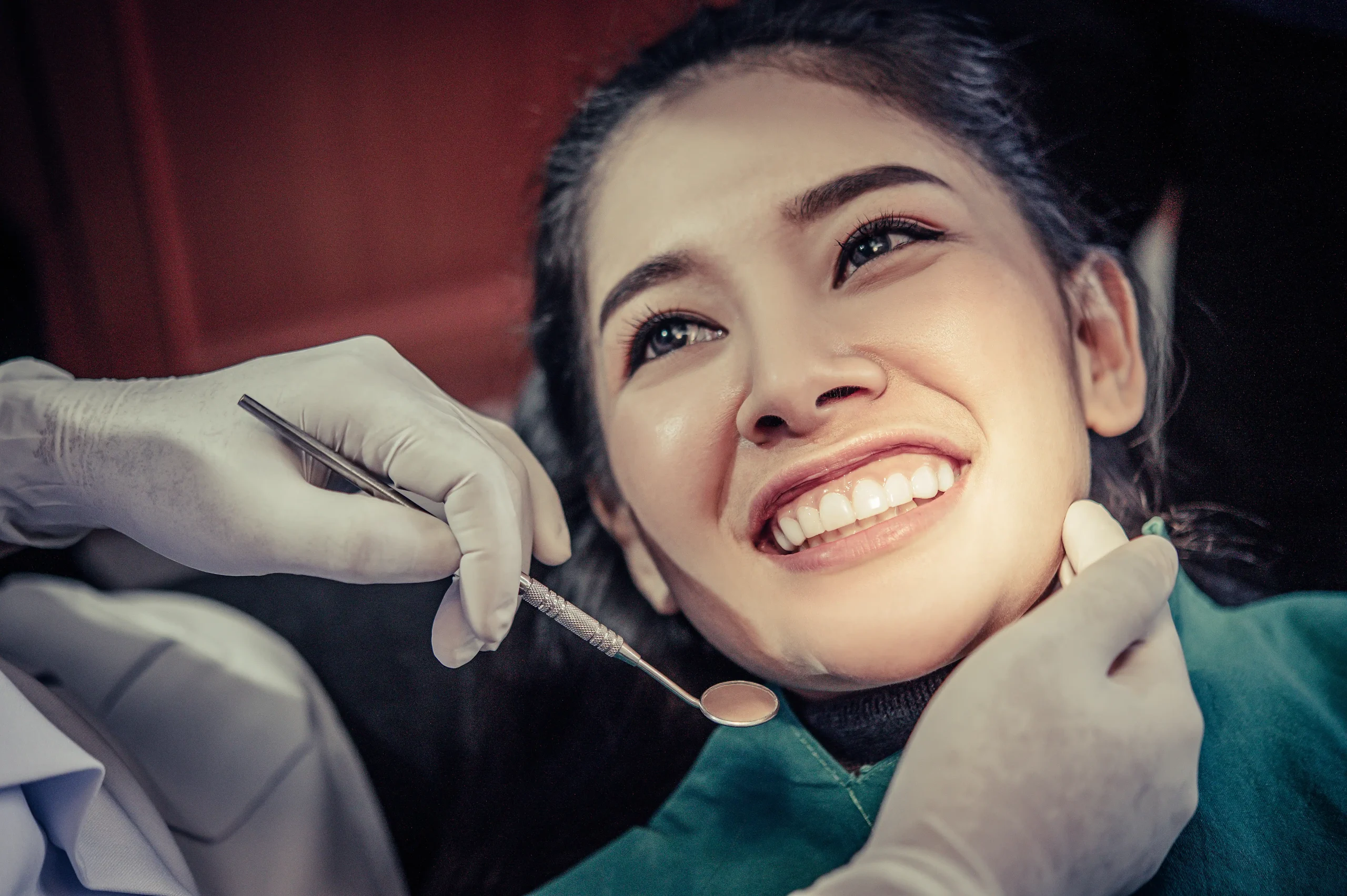 Smiling patient after successful crown and bridge cementation